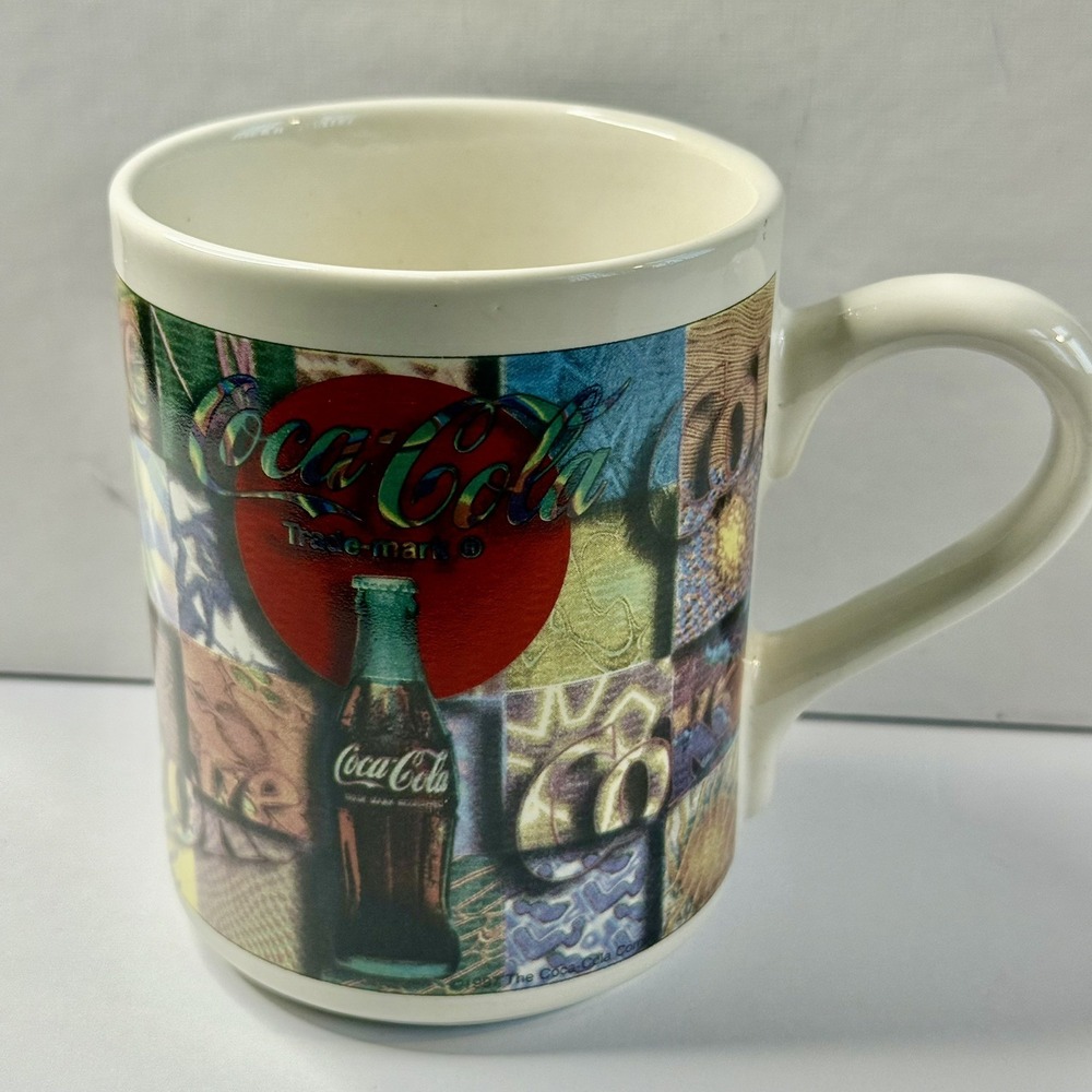 1997 Coca Cola Coffee Mug Gibson Housewares White w Multi Patten Design 16 oz.